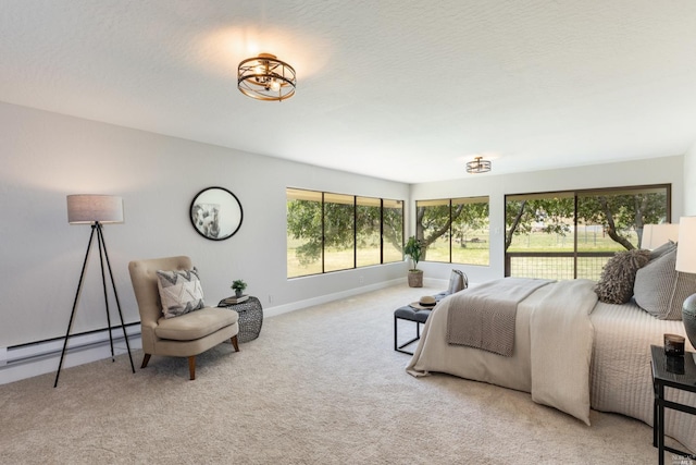 bedroom featuring baseboard heating, light colored carpet, and multiple windows