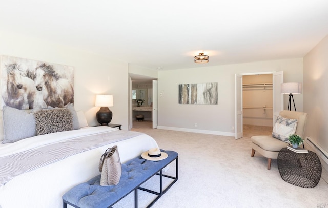 bedroom featuring light carpet, a walk in closet, and a closet