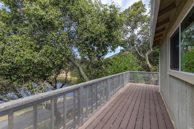 wooden terrace with a water view