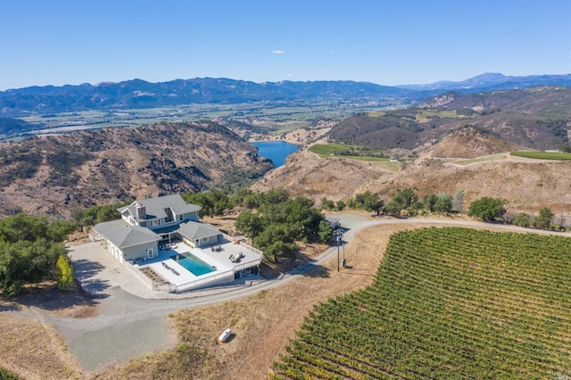 birds eye view of property with a mountain view and a rural view