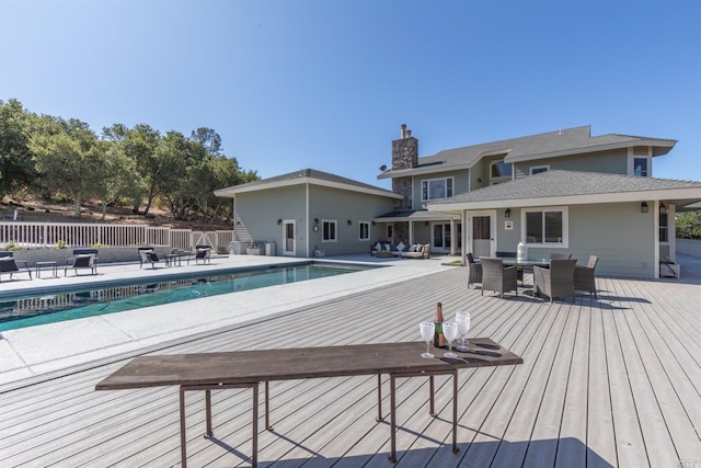 view of swimming pool featuring a deck