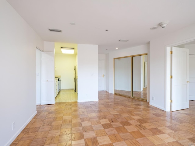 empty room featuring light parquet flooring