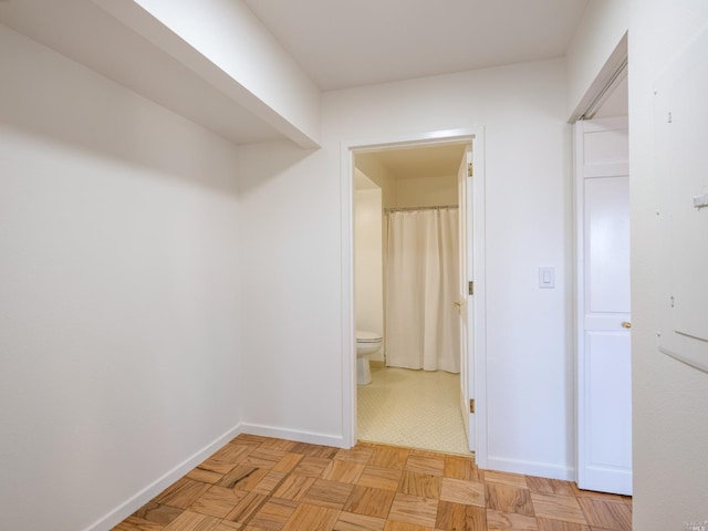 hallway featuring light parquet floors