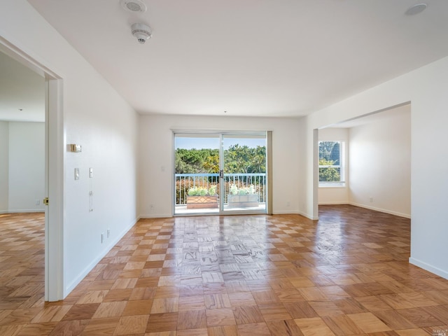 spare room featuring light parquet flooring