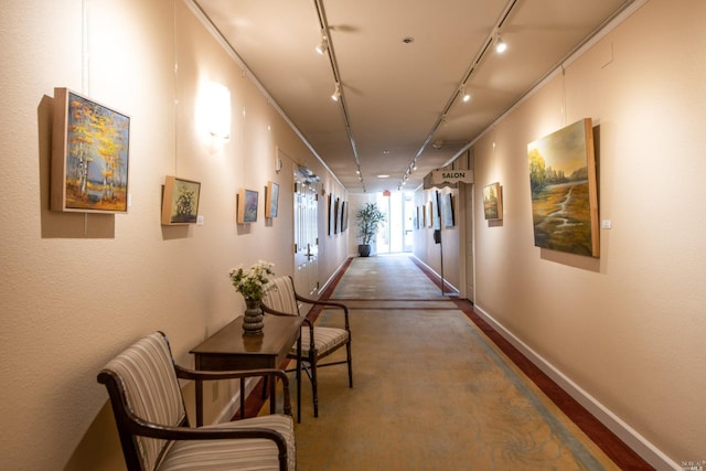 hallway featuring rail lighting