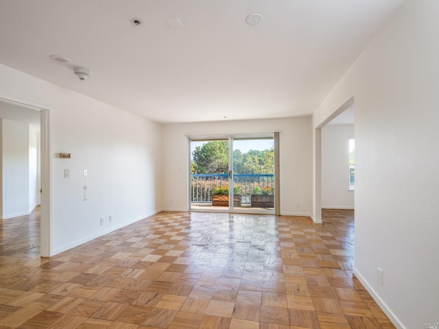 unfurnished room with light parquet floors