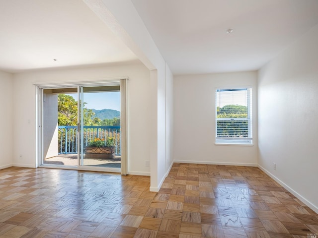 spare room with light parquet floors