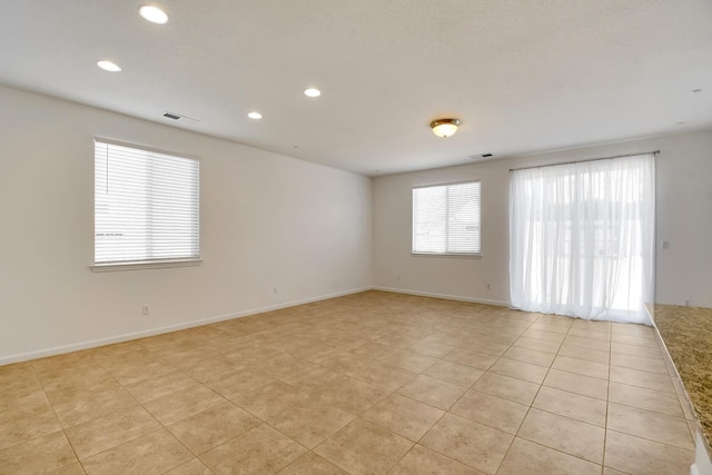 empty room with light tile floors