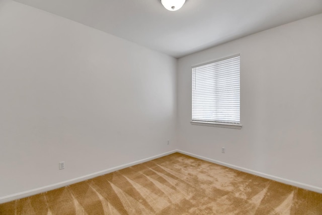 empty room with light colored carpet