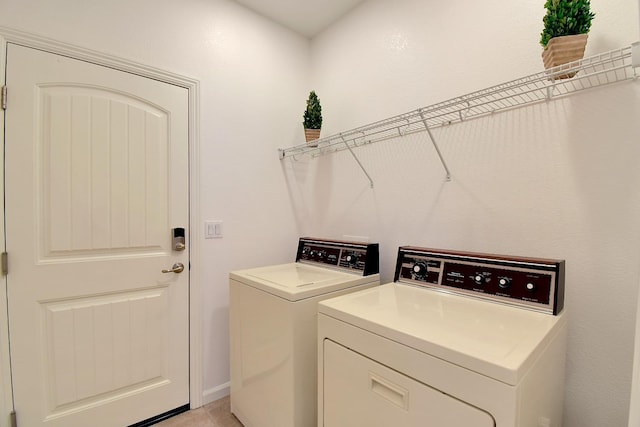 washroom featuring washing machine and dryer