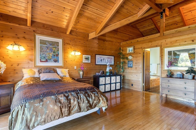 bedroom featuring wooden ceiling, wooden walls, ensuite bathroom, and light hardwood / wood-style floors