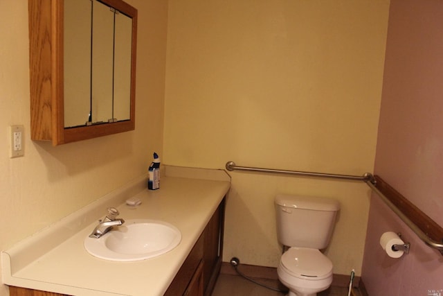 bathroom with oversized vanity and toilet