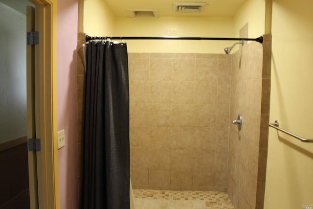 bathroom with a shower with shower curtain