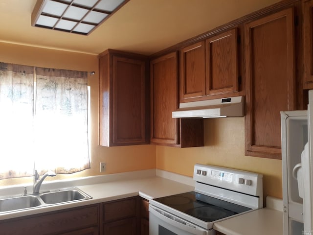 kitchen featuring white range with electric cooktop and sink