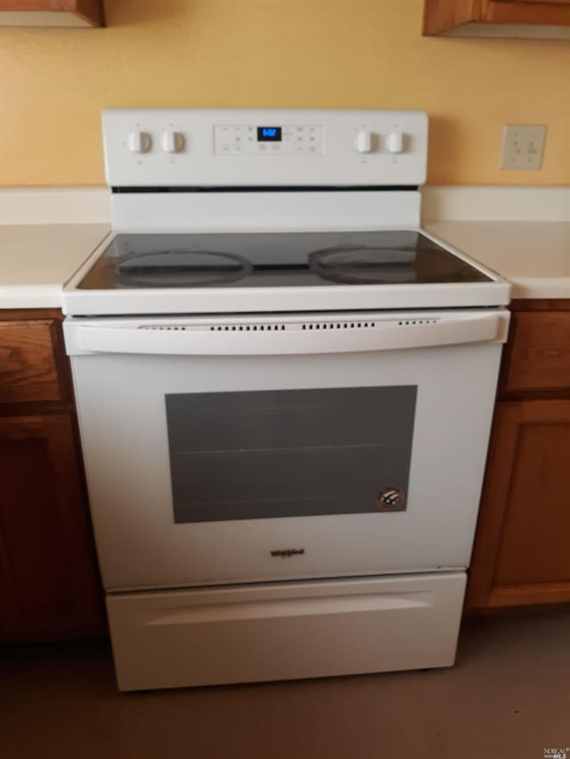 room details featuring white electric stove