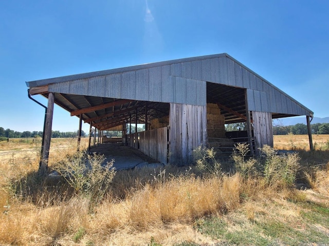 view of outdoor structure featuring a rural view