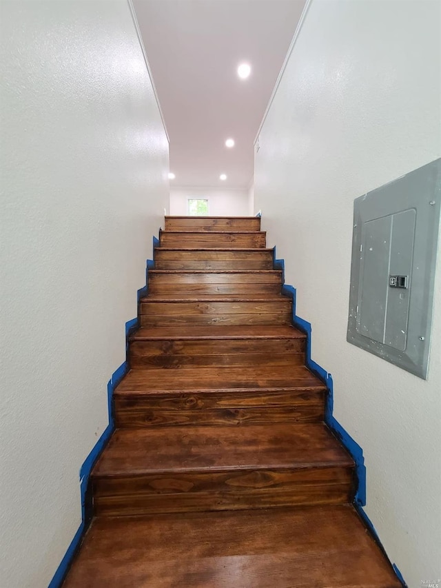 stairway featuring dark hardwood / wood-style flooring