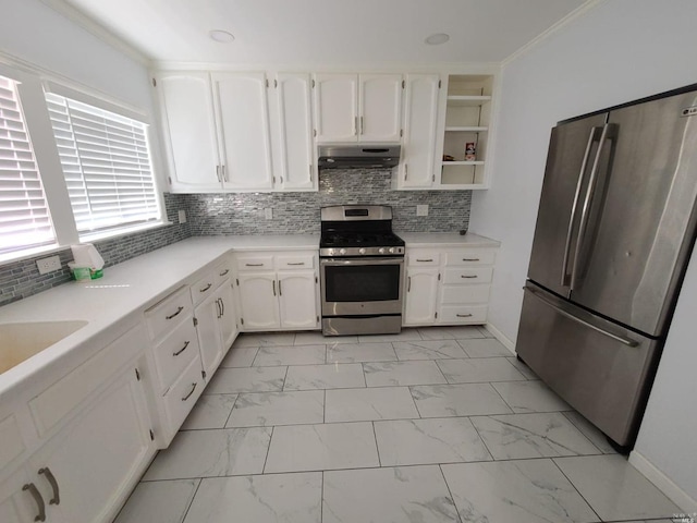 kitchen featuring appliances with stainless steel finishes, backsplash, light tile floors, white cabinetry, and crown molding