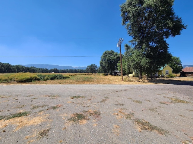 view of street featuring a mountain view and a rural view