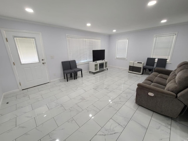 living room with ornamental molding and light tile floors