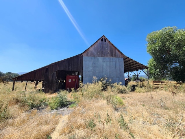 view of shed / structure featuring a rural view