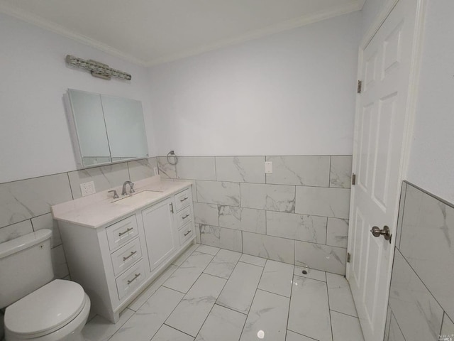 bathroom featuring vanity, tile walls, tile flooring, toilet, and crown molding