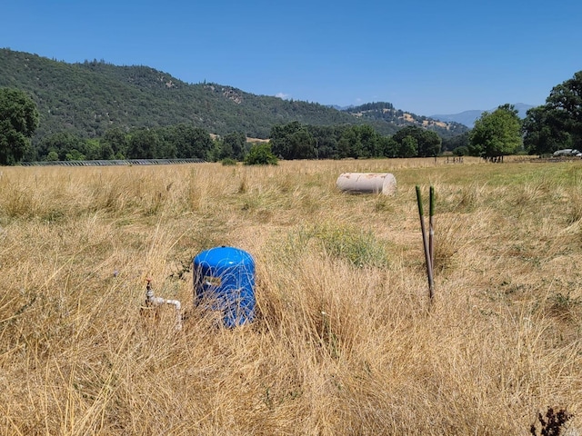 mountain view featuring a rural view