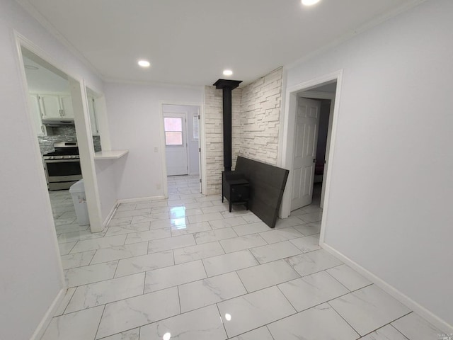 hall featuring crown molding and light tile flooring