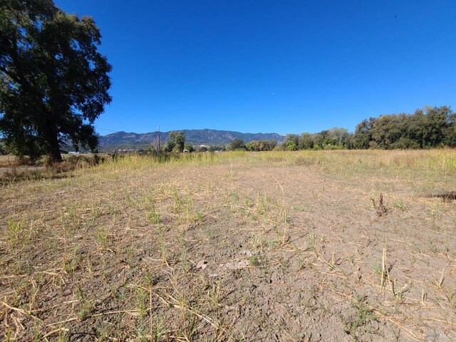 property view of mountains featuring a rural view