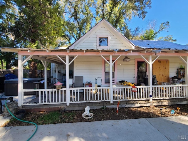 country-style home featuring a porch