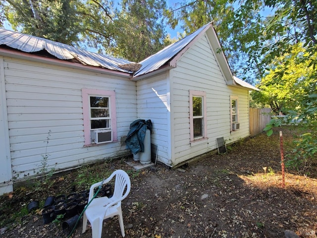 view of side of home with cooling unit