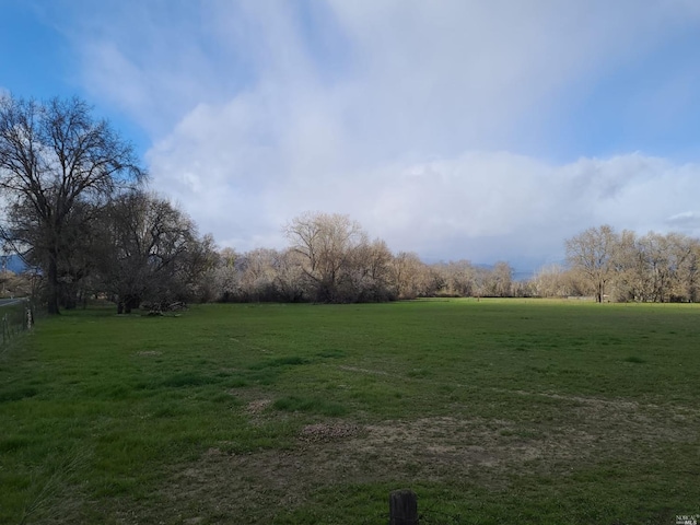 view of yard with a rural view