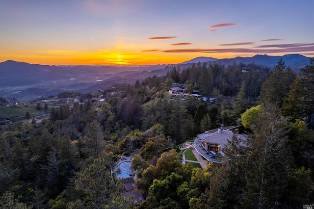 aerial view at dusk with a mountain view