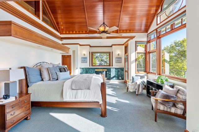 bedroom with wood ceiling, multiple windows, ceiling fan, and light colored carpet