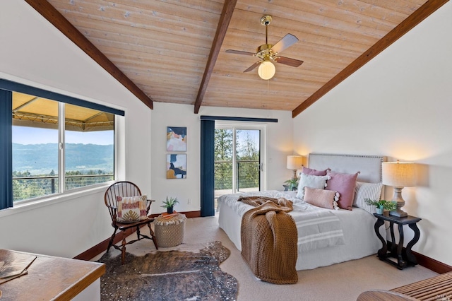 carpeted bedroom with a mountain view, wood ceiling, ceiling fan, and vaulted ceiling with beams