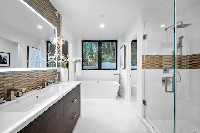 full bathroom with vanity, plus walk in shower, backsplash, tile floors, and toilet