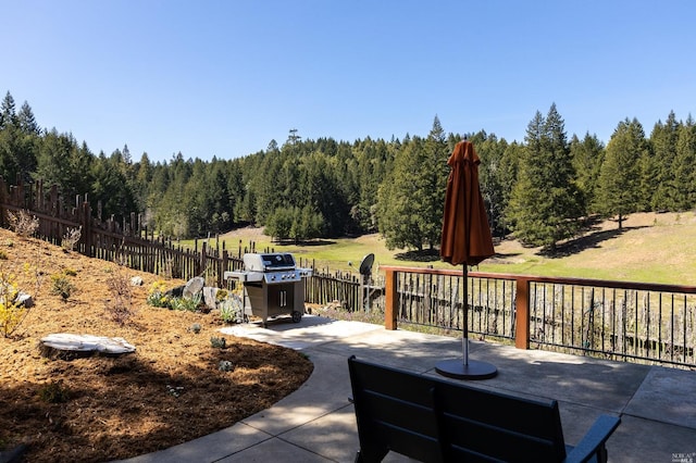31650 Sherwood Rd, Willits, CA 95490 - view of patio / terrace featuring grilling area, a wooded view, and fence