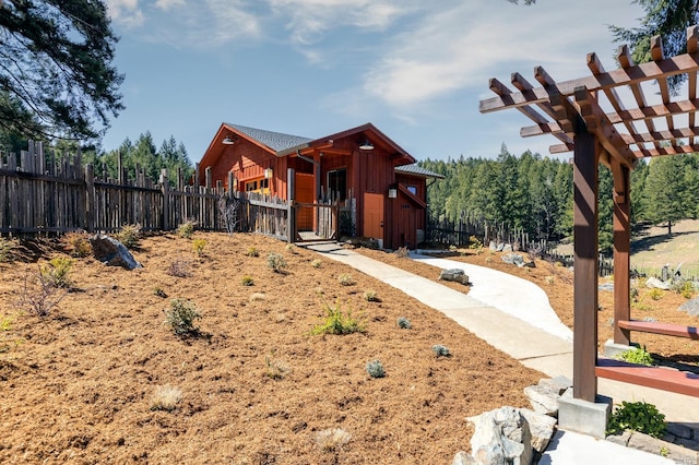 31650 Sherwood Rd, Willits, CA 95490 - view of front facade featuring fence, a pergola, and board and batten siding