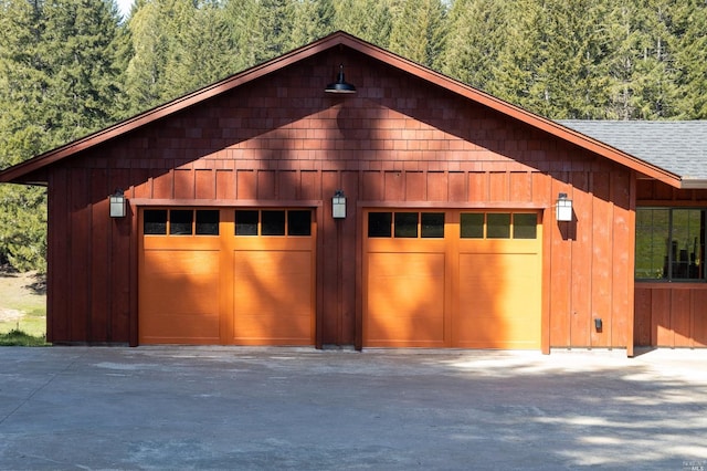 31650 Sherwood Rd, Willits, CA 95490 - garage featuring driveway and a wooded view