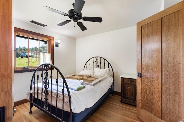 31650 Sherwood Rd, Willits, CA 95490 - bedroom featuring wood finished floors, visible vents, a ceiling fan, and baseboards