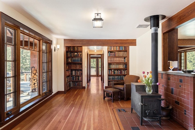 31650 Sherwood Rd, Willits, CA 95490 - sitting room featuring baseboards, wood finished floors, visible vents, and a wood stove