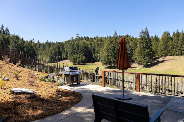 31650 Sherwood Rd, Willits, CA 95490 - view of patio / terrace featuring a grill, a view of trees, and fence