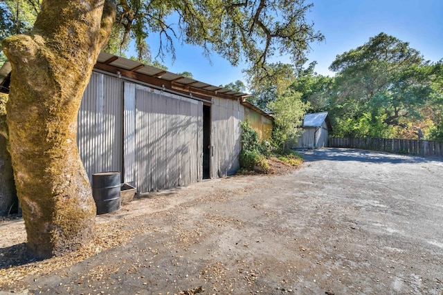 view of property exterior featuring an outdoor structure