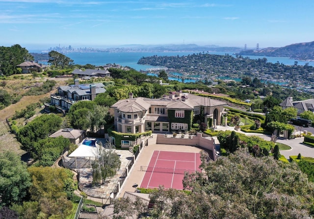 birds eye view of property with a water view