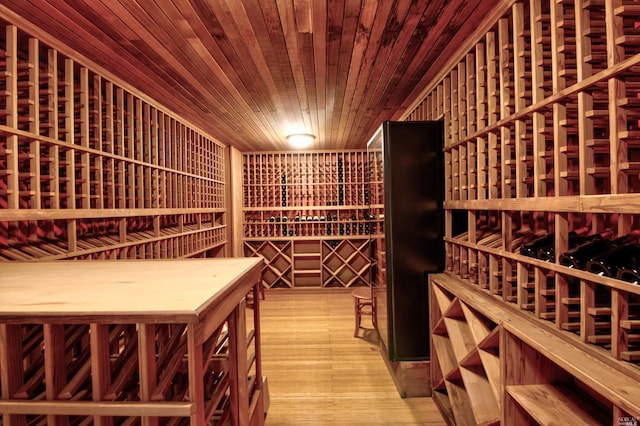 wine room featuring wooden ceiling and light wood-type flooring