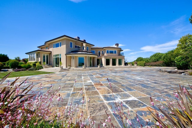 back of property featuring a patio area