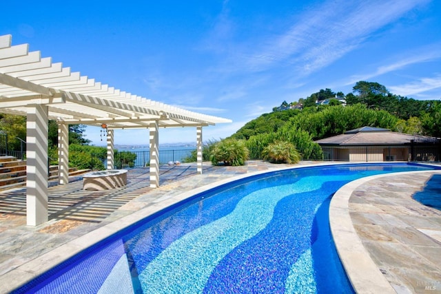 view of swimming pool featuring a pergola and a patio