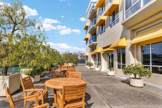 view of patio featuring a balcony