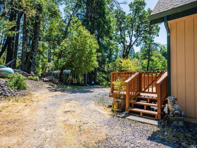 view of yard with a wooden deck