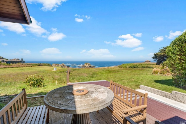 wooden deck with a water view